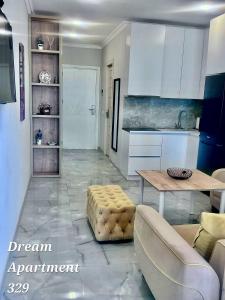 a living room with a table and a kitchen at Bamboo beach in Ts'ikhisdziri