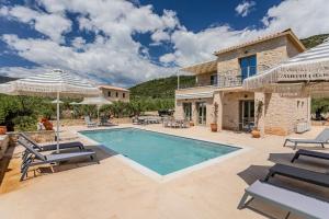 an image of a villa with a swimming pool at The Olive Grove Kardamyli in Kardamyli