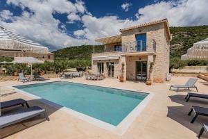an image of a villa with a swimming pool at The Olive Grove Kardamyli in Kardamyli
