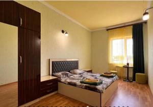 a bedroom with a bed with two plates on it at Near Yerevan Serlinhouse in Oshakan +24 photos