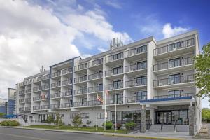an apartment building with a white building at Best Western Plus Ocean City in Ocean City