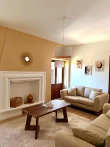 a living room with a couch and a coffee table at Casa Olivia Bardolino - Garda Lake in Bardolino