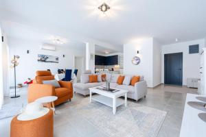 a living room with a couch and a table at Villa Montenegrina in Krapina