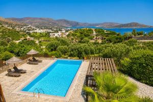 a villa with a pool and a view at Villa Glan Y Mor in Elounda