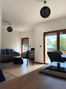 a living room with a couch and a table at Tri ville in Žabljak