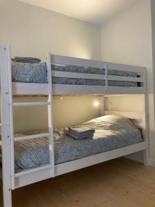 a bedroom with two bunk beds in a room at Gite l'Entre Deux O' in Blesle