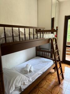 two bunk beds in a room with towels on them at Dimora Ludovica in Selvino