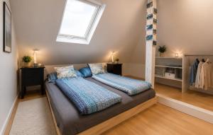 a large bed in a room with a window at Ferienwohnung Attersee in Steinbach am Attersee