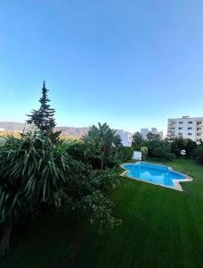 an image of a swimming pool in a yard at Residence oum kaltoum in Oued Laou +9 photos