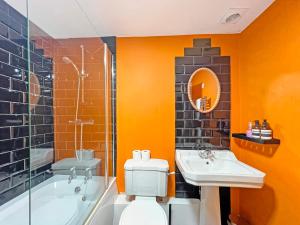 a bathroom with a toilet and a sink and a tub at Kiri Cottage Hawkridge in Dulverton +48 photos