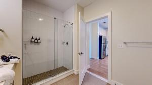 a bathroom with a shower with a glass door at Elegant Home in Stamford +41 photos