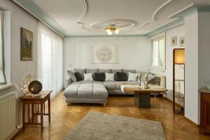 a living room with a couch and a table at Haus Bergharmonie in Tschagguns