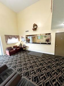 a living room with a couch and a table at PATRIOT INN in Spencer