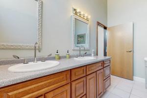 a bathroom with two sinks and a mirror at Lake Shore Drive in Franklin +35 photos