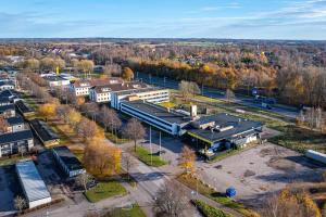 an aerial view of a building with a train station at First Hotel Halmstad East in Halmstad