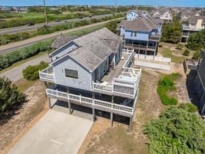 an aerial view of a house with a porch at Seaside 46 in Nags Head