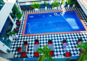 an overhead view of a swimming pool with red and white tiles at Parkview Astoria Hotel in Lagos