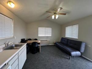 a kitchen with a couch and a table and a ceiling fan at Bryce Canyon Resort in Bryce Canyon