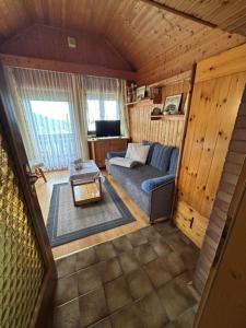 an overhead view of a living room with a couch at Appartments Prinz - Gerlitze in Tobitsch