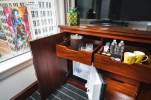 a cabinet with a television in a room at Staypineapple, An Iconic Hotel, The Loop in Chicago