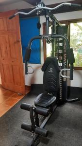a gym with a exercise bike in a room at Garden Rooms in Bocas Town