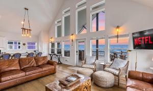 a living room with a couch and chairs at Spacious Beachfront 5BR with Gorgeous Ocean views - Blue Footed in Bolivar Peninsula
