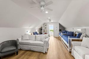 a living room with two couches and a couch at Spacious Beachfront 5BR with Gorgeous Ocean views - Blue Footed in Bolivar Peninsula +145 photos