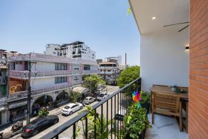 a balcony with a view of a city at Unit Aguacates Romantic Zone in Puerto Vallarta