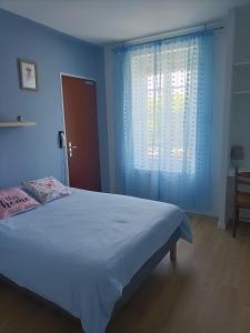a bedroom with a large bed and a window at La Sterne in Saint-Gilles-Croix-de-Vie +27 photos