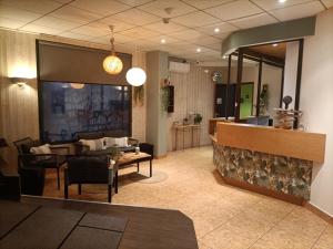 a living room with a couch and a fireplace at La Sterne in Saint-Gilles-Croix-de-Vie