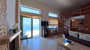 a living room with a view of the ocean at Theologos Ridge in Theologos