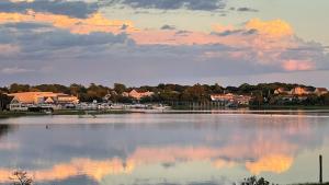 a view of a lake with a town in the background at Waterfront Escape with Stunning Views on Bass River in West Dennis +31 photos