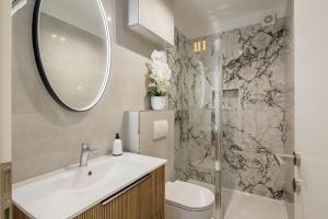 a bathroom with a toilet and a sink and a shower at Villa Mare's in Primošten +87 photos