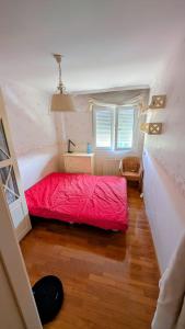 a bedroom with a red bed and a window at NEXT STOP PLAYA SALINAS in Salinas +19 photos