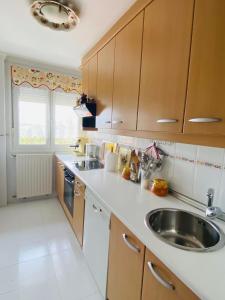 a kitchen with a sink and a counter top at NEXT STOP PLAYA SALINAS in Salinas