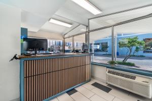 an office with a bar with a view of a street at SureStay Hotel by Best Western Virginia Beach Royal Clipper in Virginia Beach