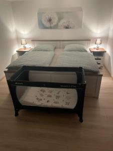 a bed in a bedroom with two twin beds at Ferienwohnung Lolek in Brilon