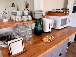 a kitchen counter with a counter top with food and appliances at The Stykkishólmur Inn by Ourhotels in Stykkishólmur