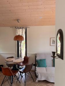 a living room with a table and chairs and a couch at WieloHome in Wielogóra +32 photos