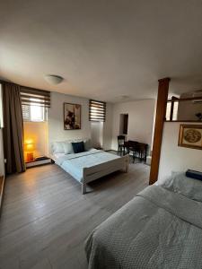 a bedroom with a bed and a table in it at Studios Jacobus in Korčula