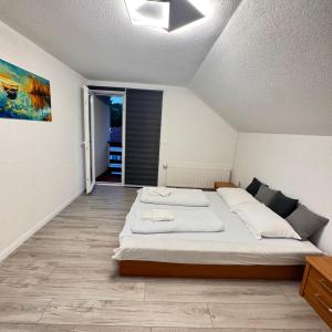 a bedroom with a large bed in a room at Villa RELAX Miševići in Sarajevo +90 photos