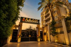 a building with a sign that reads x lawlandania at La Veranda Pyramids View Hotel in Cairo