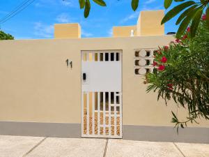 a door in the side of a house at Palma 11 Boutique House Downtown Cancun in Cancún