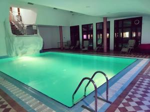 a large swimming pool in a hotel room at Monti Wellness & Spa Vlašić in Vlasic