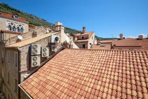 a view of a red tile roof of a town at Hedera Estate Hedera A34 in Dubrovnik