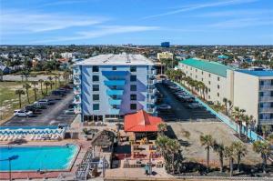 an aerial view of a resort with a swimming pool at Luxury Beach Condos with Pool and Tiki Bar! in Daytona Beach