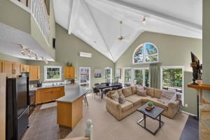 a kitchen and living room with a couch and a table at Marble Canyon in Fairmont Hot Springs