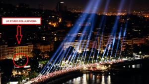 a lit up bridge over a city at night at Lo Studio della Riviera in Naples +4 photos