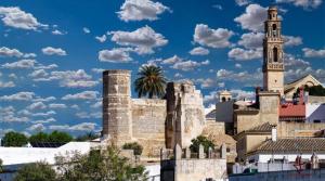 a city with a clock tower and a church at HOME CENTRO B max 5 personas HOME CENTRO A max 6 personas in Marchena