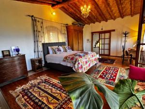 a bedroom with a bed and a couch in a room at A historic STONE VILLA with private garden, terrace and private pool just for you in Kyrenia +94 photos